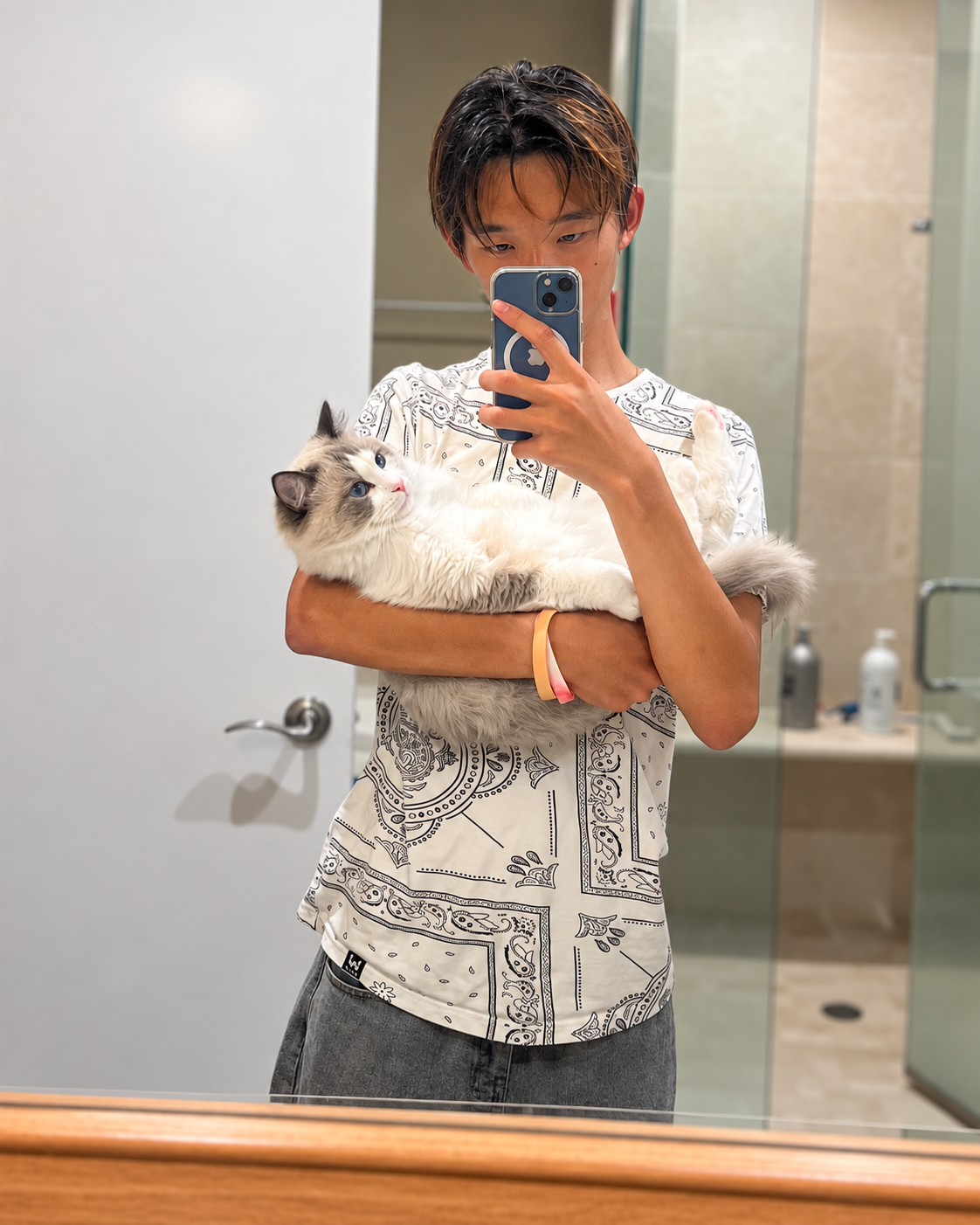 Lucas Su holding his cat Loki